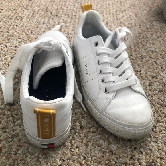 These are white Tommy Hilfiger womens sneakers. - Picture 2 of 4